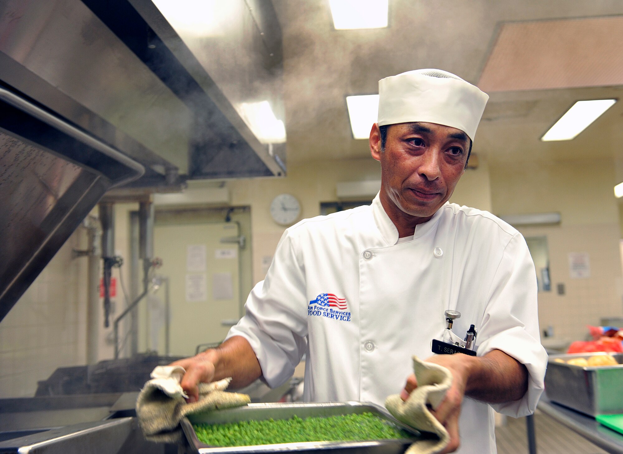 Takashi Seragaki, 18th Force Support Squadron cook, prepares lunch at the Marshall Dining Facility, June 3, 2016, at Kadena Air Base, Japan. Seragaki said he became a cook because most of the people he knew were also cooks. (U.S. Air Force photo by Naoto Anazawa)

