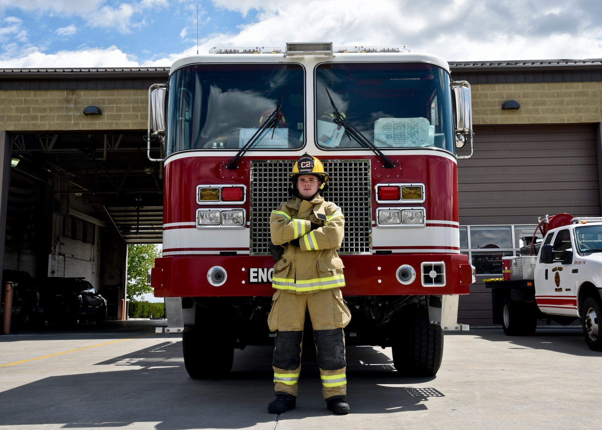 Airman 1st Class Shawn Mercer, 92nd Civil Engineer Squadron firefighter, stands proudly in front of a fire engine May 25, 2016, at Fairchild Air Force Base, Wash. Fire Protection specialists deal with everything from brush fires to burning rocket fuel and hazardous material fires. After the initial 7.5 weeks of Basic Military Training, Airmen who want to be firefighters will attend Goodfellow Air Force Base, Texas for five months of basic firefighting skills. “My uncle was a firefighter and I loved hearing his stories,” Mercer said. “I went along with the volunteer firefighters from my town a few times to watch and knew it is what I wanted to do.” (U.S. Air Force photo/Airman 1st Class Taylor Shelton)