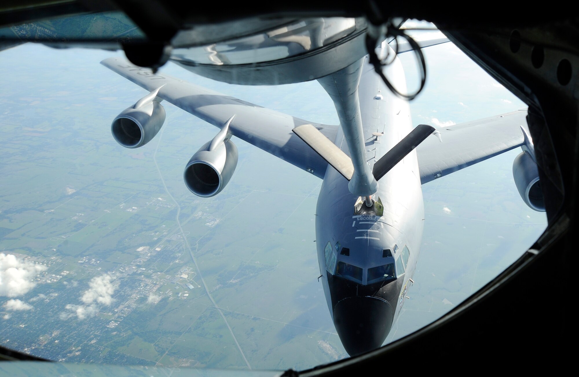 A KC-135 Stratotanker offloads fuel to another KC-135, June 3, 2016, over Kansas. Both aircraft are assigned to McConnell Air Force Base, Kan., and train together regularly. (U.S. Air Force photo/Staff Sgt. Rachel Waller)