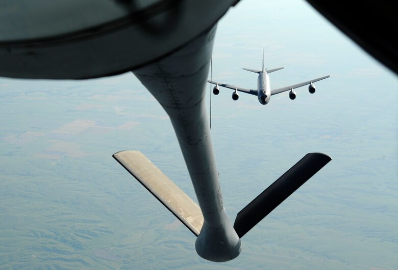 A KC-135 Stratotanker assigned to 22nd Air Refueling Wing approaches another KC-135 for aerial refueling, June 3, 2016, over Kansas. Some of the 59-year-old aircraft have been modified to receive fuel while in-flight. (U.S. Air Force photo/Staff Sgt. Rachel Waller)