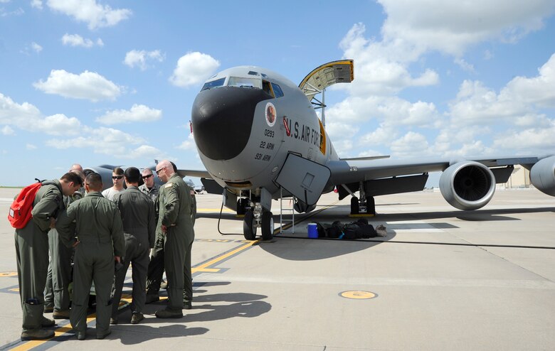 Aircrew and maintenance Airmen assigned to the 22nd Air Refueling Wing conduct preflight checks before a training sortie, June 3, 2016, at McConnell Air Force Base, Kan. Before every mission, Airmen work together to ensure the aircraft is air worthy. (U.S. Air Force photo/Staff Sgt. Rachel Waller)