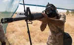 A Peshmerga soldier practices aiming down his sights while wearing a chemical protective mask during a chemical, biological, radiological, and nuclear class at a base near Erbil, Iraq, May 25, 2016. As part of a 10-week basic infantry course, CBRN training is provided to Peshmerga soldiers to aid in the fight against ISIL.  (Army Photo by Spc. Jaquan P. Turnbow)