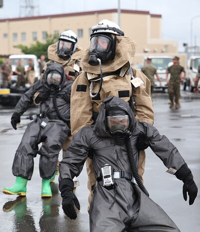 U.S. Marines from 3rd Marine Division, Chemical, Biological, Radiological and Nuclear defense platoon, Headquarters Battalion, III Marine Expeditionary Force, evacuate simulated casualties during exercise Habu Sentinel 16 at Disaster Village, Marine Corps Air Station Iwakuni, Japan, June 7, 2016. As the annual capstone exercise for the division’s response element, this event encompasses multiple objectives specific to CBRN response and validates unit standard operating procedures in an unfamiliar training environment. (U.S. Marine Corps photo by Sgt. Jessica Quezada/Released)