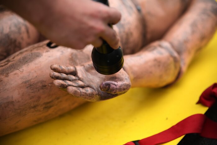 Simulated casualties are screened for chemicals after decontamination during exercise Habu Sentinel 16 at Disaster Village, Marine Corps Air Station Iwakuni, Japan, June 6, 2016. As the annual capstone exercise for the 3rd Marine Division, Chemical, Biological, Radiological and Nuclear defense platoon, Headquarters Battalion, III Marine Expeditionary Force, response element, this event encompasses multiple objectives specific to CBRN response and validates unit standard operating procedures in an unfamiliar training environment. (U.S. Marine Corps photo by Sgt. Jessica Quezada/Released)
