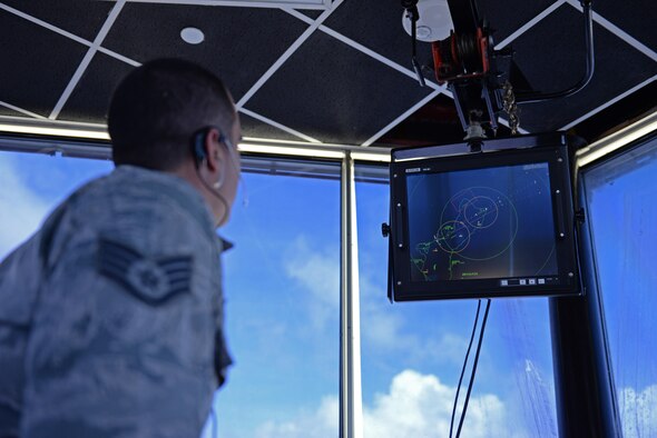 Staff Sgt. Nicholas Barsenas, 36th Operations Support Squadron air traffic controller, reads a radar display June 2, 2016, at Andersen Air Force Base, Guam. Radar systems allow air traffic controllers to track aircraft as they move through airspace surrounding the island. (U.S. Air Force photo by Airman 1st Class Jacob Skovo)