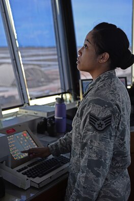 Staff Sgt. Tiffany Degracia, 36th Operations Support Squadron air traffic controller, communicates with flightline operators June 2, 2016, at Andersen Air Force Base, Guam. Andersen AFB’s controllers operate by sight but also use radar to assist in improving safety on the flightline. (U.S. Air Force photo by Airman 1st Class Jacob Skovo)