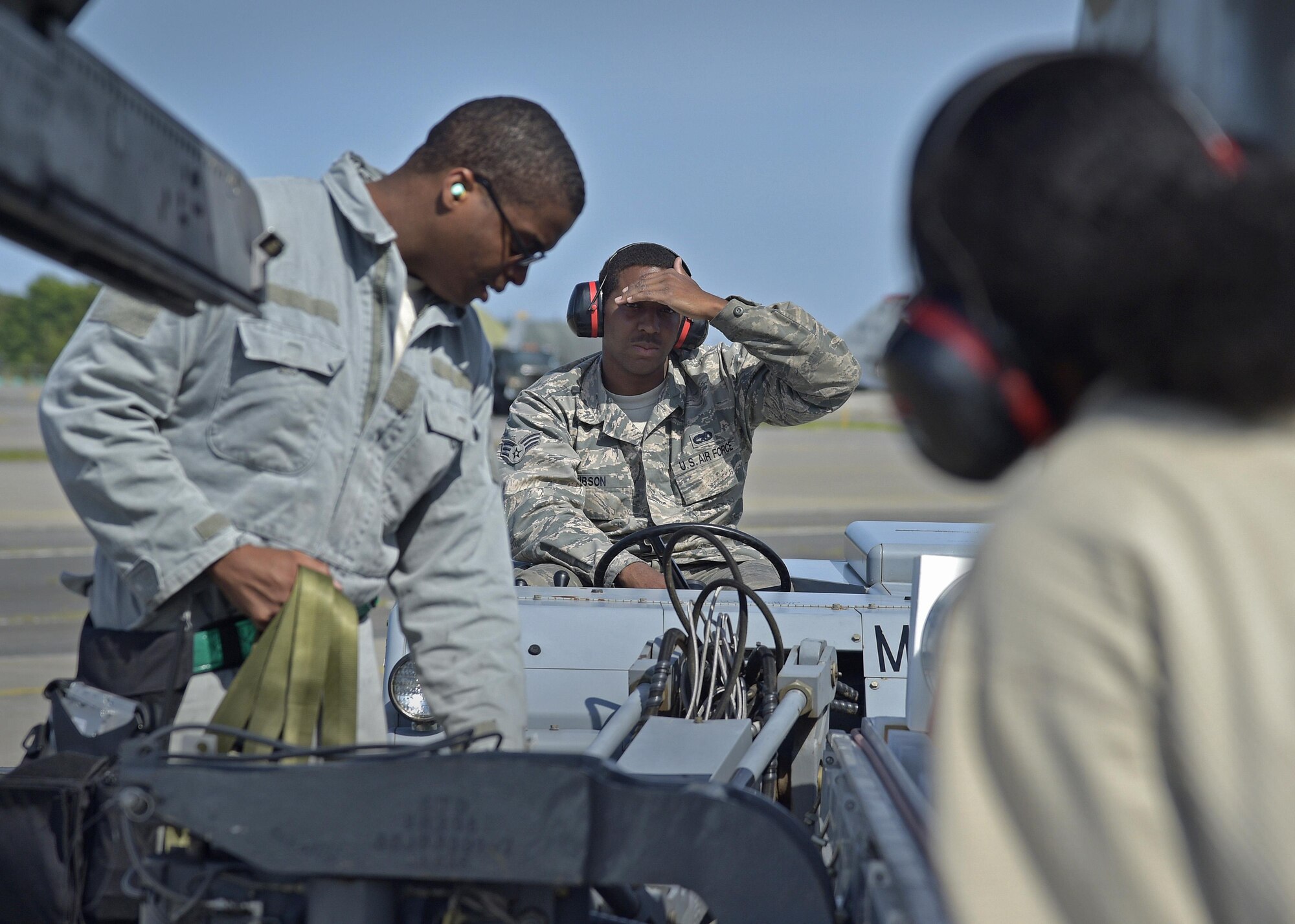 U.S. Air Force Staff Sgt. Miles Smith (left) Senior Airman Mitchell Gibson (center) and Airman 1st Class Lanell Lewis (right) armament systems specialists with the 35th Aircraft Maintenance Squadron, maneuver an AGM-88 high-speed anti-radiation missile out of a housing casket at Misawa Air Base, Japan, June 6, 2016. Smith, Gibson and Lewis participated in a three-day surge, sharping their proficiency in aircraft maintenance and wartime operations. (U.S. Air Force photo by Senior Airman Deana Heitzman)