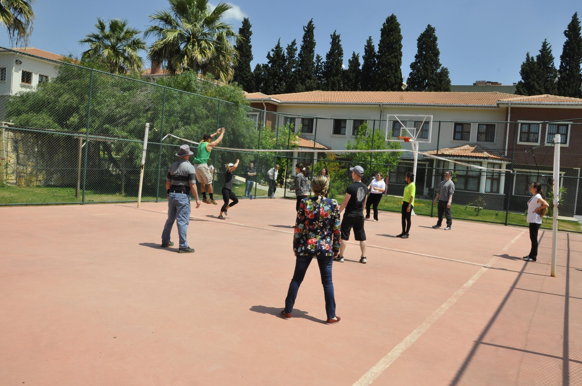 Turkish girls and their guests from NATO and the 425th ABS enjoy a volleyball game at a local girls’ care and rehabilitation center.
