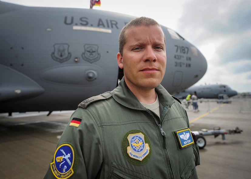 Maj. Rico Persy, 14th Airlift Squadron C-17 pilot, prepares for the opening day of the Berlin Air Show June 1, 2016 in Berlin, Germany. Persy is a native of Hamburg, Germany, and has been actively serving in Germany’s Personnel Exchange Program. (U.S. Air Force photo by Senior Airman Tom Brading)