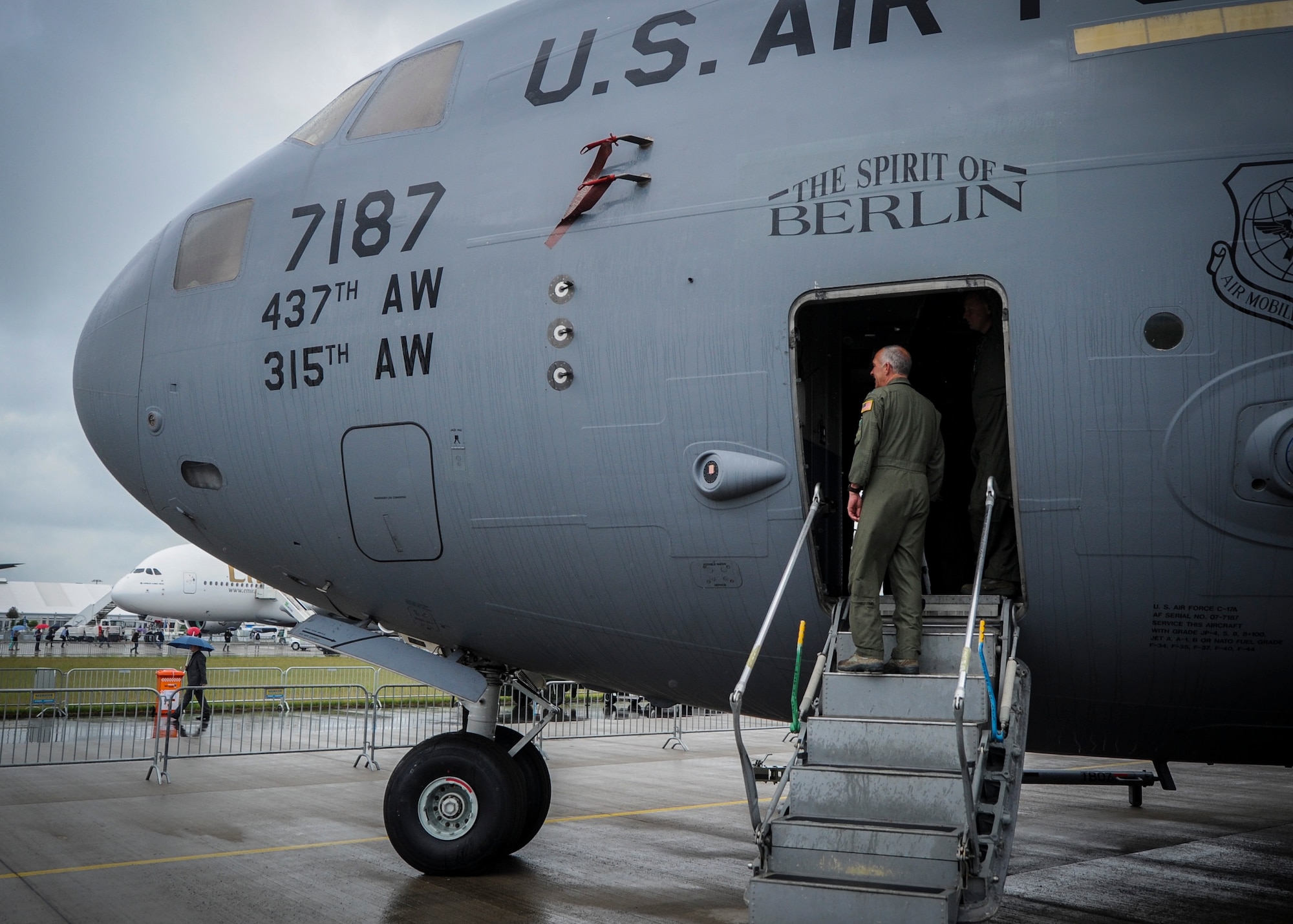 Lt. Col. Craig Bartosh, 701st Airlift Squadron aircraft commander, boards The Spirit of Berlin C-17 Globemaster III at the 2016 Berlin Airshow earlier this month in June to help prepare the Charleston jet for the day's visitors.  Approximately 230,000 visitors and exhibitors from more than 65 countries attended the show. (U.S. Air Force photo by Senior Airman Tom Brading)
