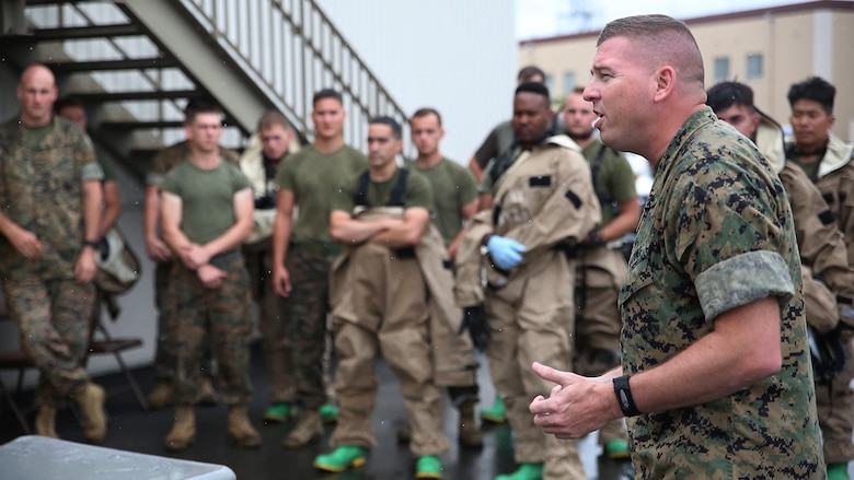 U.S. Marine Corps Chief Warrant Officer Christopher Joy, Chemical, Biological, Radiological and Nuclear defense officer with 3rd Marine Division, CBRN defense platoon, Headquarters Battalion, III Marine Expeditionary Force, mentors his Marines before they respond to a simulated CBRN threat during exercise Habu Sentinel  16, at Disaster Village, Marine Corps Air Station Iwakuni, Japan, June 6, 2016. As the annual capstone exercise for the division’s response element, this event encompasses multiple objectives specific to CBRN response and validates unit standard operating procedures in an unfamiliar training environment.