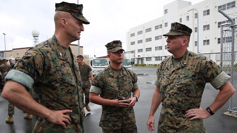 From left to right, U.S. Marine Corps Col. Daniel Shipley, commanding officer of Marine Aircraft Group 12, Chief Warrant Officer Jonathan B. Davis, Chemical, Biological, Radiological and Nuclear officer in charge with MAG-12, and Chief Warrant Officer Christopher Joy, CBRN defense officer with 3rd Marine Division, CBRN defense platoon, Headquarters Battalion, III Marine Expeditionary Force, discuss mission objectives during exercise Habu Sentinel 16, at Disaster Village, Marine Corps Air Station Iwakuni, Japan, June 7, 2016. Third Marine Division CBRN Marines traveled to MCAS Iwakuni for this event and worked with MAG-12 personnel in developing technical skills critical to their profession.  As the annual capstone exercise for the division’s response element, this event encompasses multiple objectives specific to CBRN response and validates unit standard operating procedures in an unfamiliar training environment. 