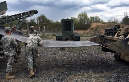 Troops of the New York Army National Guard’s 204th Engineer Detachment (Quarry) remove a failing conveyor belt from a quarry machine called a “crusher” here on May 14, 2016. Operating the crusher, which can turn large rocks into various grades of construction material, is the detachment’s main mission. Soldiers of the detachment, which is based in Binghamton, N.Y., worked for about 10 hours on May 14 to fix several mechanical shortfalls and ensure the crusher is operational for the detachment’s annual training in July.