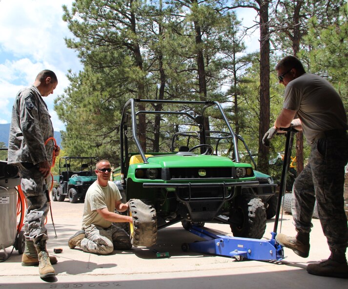 932nd Civil Engineering Squadron Airmen work fixing a tire for their transportation vehicle at a remote Air Force Academy site while performing temporary duty in the Field Engineering and Readiness Laboratory (FERL).  932nd CE helped completing many projects that will provide students with a solid foundation for learning scientific theory and engineering design principles in more advanced courses of the civil and environmental engineering curriculum. The "construct first" approach is the primary focus of Civil Engineering 351 (CivEngr 351), the entry-level course for cadets majoring in Civil and Environmental Engineering at the U.S. Air Force Academy.

CivEngr 351 is an integrated, two-phase program over a five-week period. The first phase is Operation Civil Engineering Air Force (OPS CEAF). Students spend two weeks at an operational Air Force base in order to gain an appreciation of Air Force missions, support functions, and civil engineering capabilities. The second phase is FERL. During this three-week phase, students "deploy" to the FERL training area to perform hands-on activities in surveying, construction methods, and construction materials under the supervision and guidance of mentors. 932nd CE interacted with some students who will gain more experience working and living under field conditions as they utilize some of the readiness assets used in the Operational Air Force. (U.S. Air Force photos by Maj. Stan Paregien)