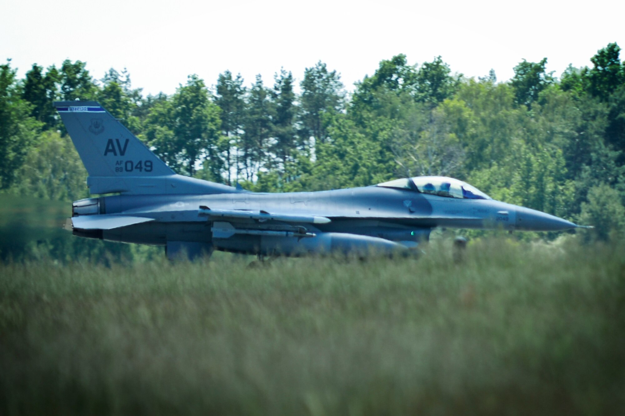 An F-16 Fighting Falcon from the 31st Fighter Wing, Aviano Air Base, Italy, takes off for a sortie during Aviation Detachment Rotation 16-3 at Lask Air Base, Poland, June 7, 2016. During the two-week training, approximately 350 personnel supporting 14 F-16s from the 31st Fighter Wing, Aviano Air Base, Italy and six F-16s from the 138th Fighter Wing, Tulsa Air National Guard, Okla., will conduct bilateral flying training focused on improving familiarization with operational and logistical processes, maintaining joint readiness and building interoperability capabilities between the Polish and U.S. air forces. (U.S. Air Force photo/Senior Airman Erin Babis)