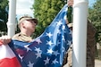 Pvt. 1st Class Austin Thompson, from Minford, Ohio, and Spc. Eric M. Johnson from Los Angeles, Ca., with the 554th Military Police Company from Stuttgart, Germany, raise the American flag for the opening ceremony of Exercise Anakonda 2016.