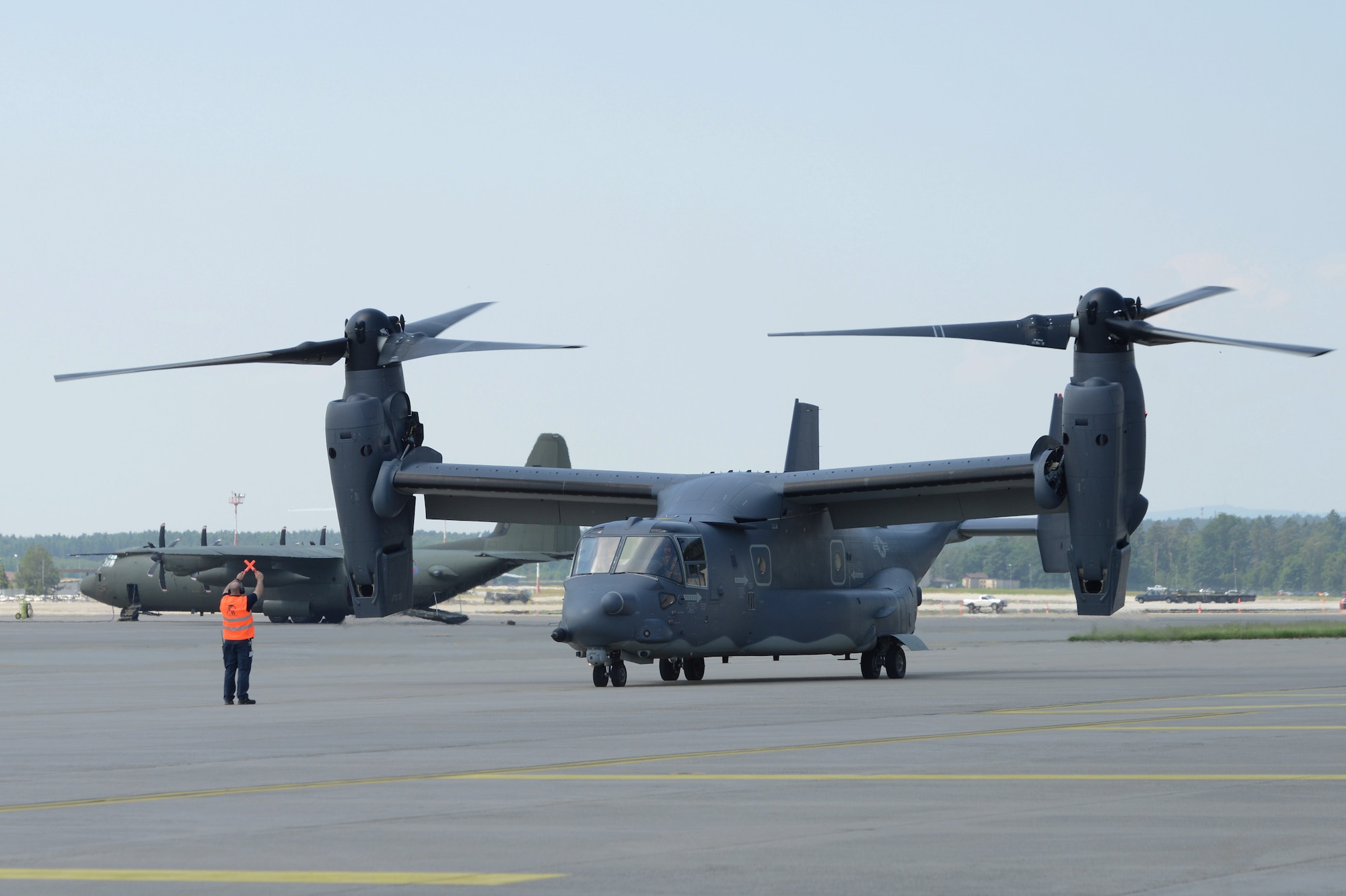 A CV-22 Osprey assigned to the 7th Special Operations Squadron at Royal Air Force Mildenhall, England, transits through Ramstein Air Base, Germany  June 6, 2016. Airmen from the 7th SOS participated in the D-Day remembrance airdrops at Normandy, France, where they supported military free-fall jumps. (U.S. Air Force Photo/ Airman 1st Class Joshua Magbanua)