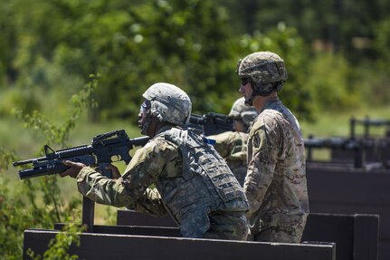 A Soldier in his 6th week of Basic Combat Training with Co. A, 3rd Bn., 39th Inf. Reg., checks to see the impact of his round down range after firing the M203 Grenade Launcher at targets on the U.S. Weapons Demonstration range at Fort Jackson, S.C., June 8. (U.S. Army photo by Sgt. 1st Class Brian Hamilton/ released)