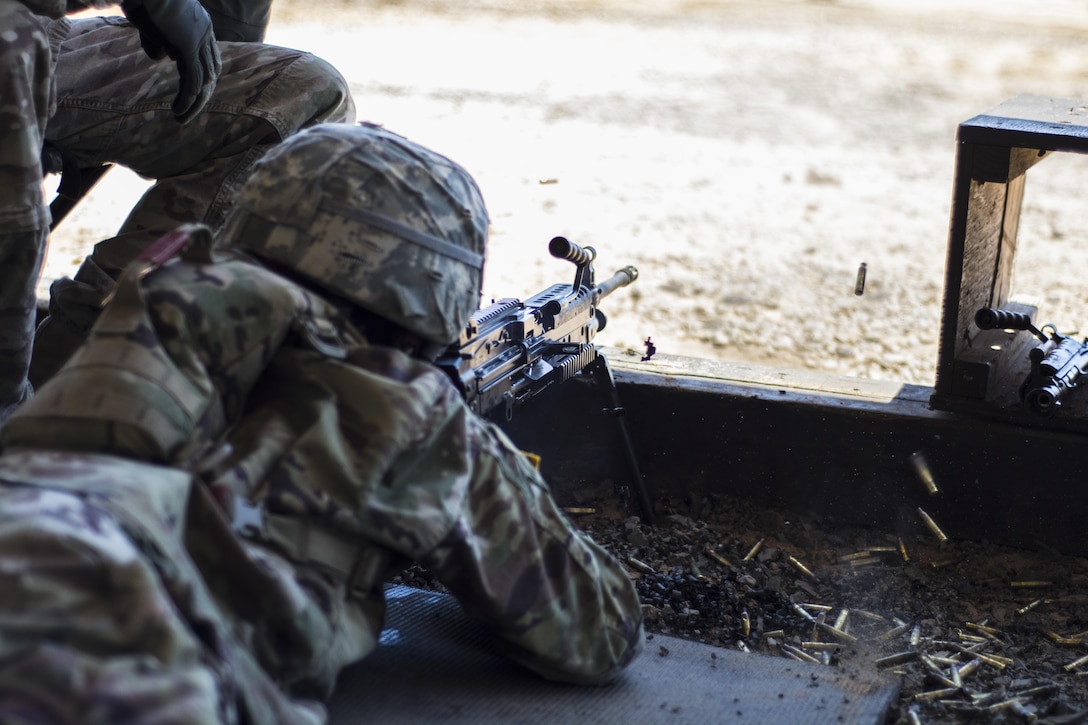 A Soldier in his 6th week of Basic Combat Training with Co. A, 3rd Bn., 39th Inf. Reg., fires the M249 Light Machine Gun at targets downrange on the U.S. Weapons Demonstration range at Fort Jackson, S.C., June 8. (U.S. Army photo by Sgt. 1st Class Brian Hamilton/ released)