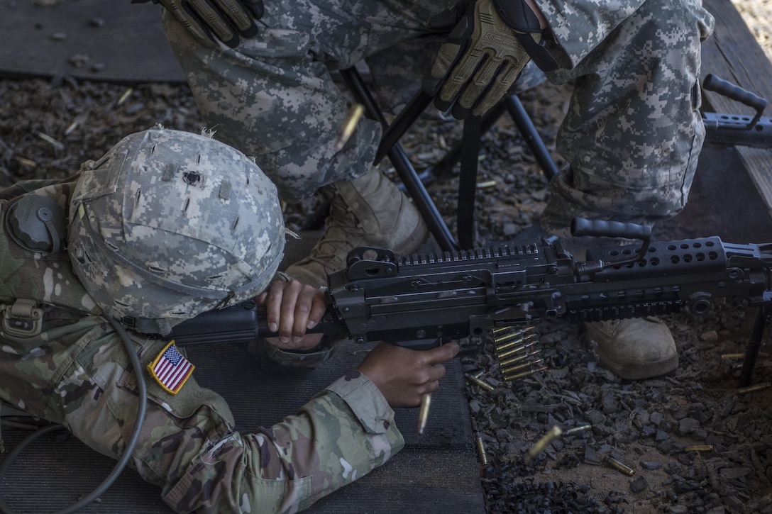 A Soldier in his 6th week of Basic Combat Training with Co. A, 3rd Bn., 39th Inf. Reg., fires the M249 Light Machine Gun at targets downrange on the U.S. Weapons Demonstration range at Fort Jackson, S.C., June 8. (U.S. Army photo by Sgt. 1st Class Brian Hamilton/ released)