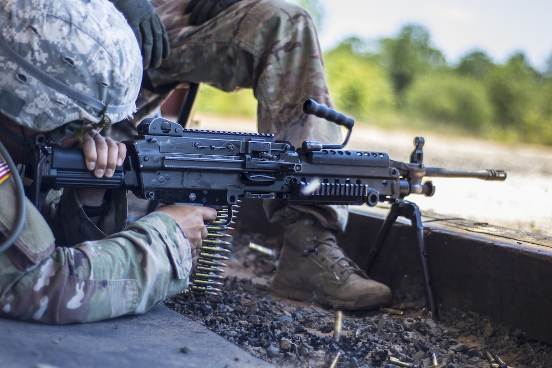 A Soldier in his 6th week of Basic Combat Training with Co. A, 3rd Bn., 39th Inf. Reg., fires the M249 Light Machine Gun at targets downrange on the U.S. Weapons Demonstration range at Fort Jackson, S.C., June 8. (U.S. Army photo by Sgt. 1st Class Brian Hamilton/ released)