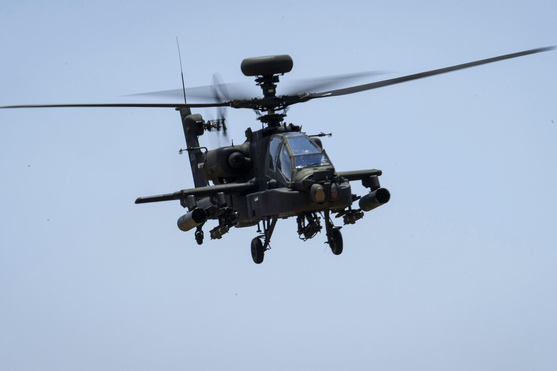An Army AH-64 Apache helicopter flies back to the helipad after participating in an attack fire mission during exercise Crescent Reach 16 at Fort Bragg, N.C., May 26, 2016. Air Force photo by Airman 1st Class Sean Carnes