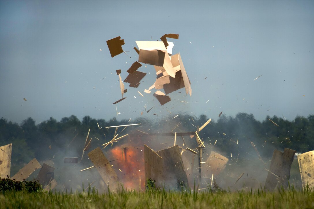 A mock house explodes after being raided by soldiers during exercise Crescent Reach 16 at Fort Bragg, N.C., May 26, 2016. Air Force photo by Airman 1st Class Sean Carnes 