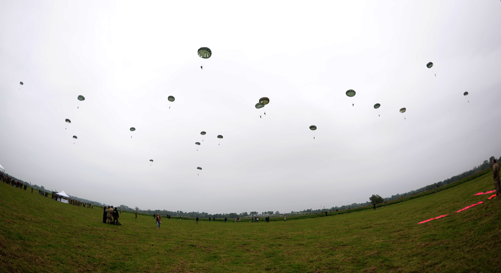 Civilians and military members from NATO allied nations perform static line and high-altitude, low opening jumps June 5, 2016, over Sainte-Mère-Église Normandy, France. The event was in honor of the many airborne troops who lost their lives during the airdrop on D-Day, June 6, 1944. 
(U.S. Air Force photo by Senior Airman Justine Rho/Released)
