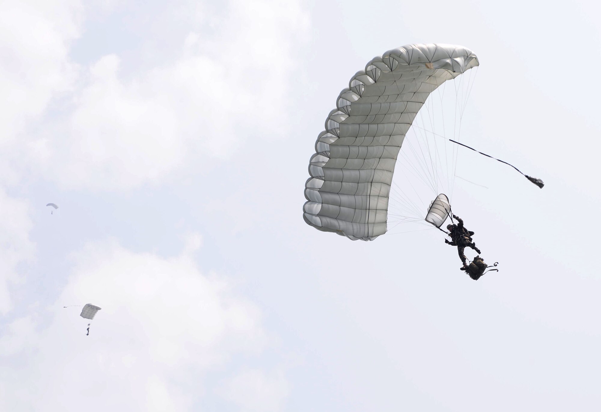 U.S. Army Special Forces airborne soldiers perform high-altitude, low opening jumps June 5, 2016, over Sainte-Mère-Église, Normandy, France. The event was in honor of the many airborne troops who lost their lives during the airdrop on D-Day, June 6, 1944. During World War II, the Battle of Normandy began on D-Day, when approximately 156,000 American, British and Canadian forces landed on five beaches along a 50-mile stretch of the coast of France’s Normandy region. (U.S. Air Force photo by Senior Airman Justine Rho/Released)