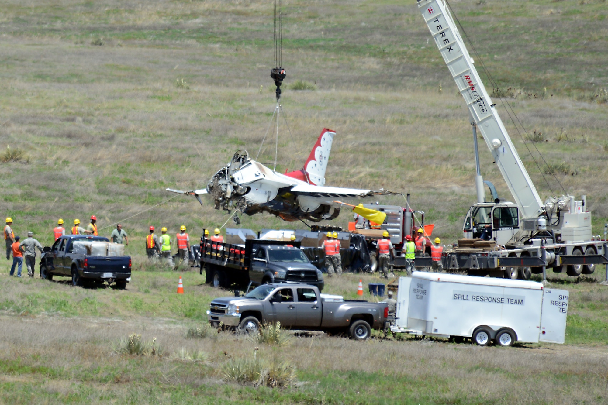 SECURITY-WIDEFIELD, Colo. – Joint service crews from several area military bases load Thunderbird 6 on a trailer for transport to Peterson Air Force Base, Colo., June 7, 2016. The aircraft crashed here June 2, 2016. (U.S. Air Force photo by Dave Meade)