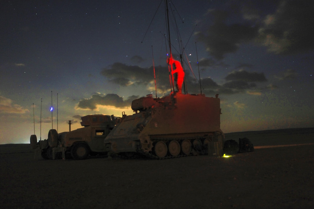 A U.S. soldier breaks down a M113 armored personnel carrier at night during exercise Eager Lion 2016, May 23, 2016 at Al Zarqa, Jordan, May 23, 2016. The soldier is assigned to the 1st Infantry Division’s 1st Infantry Battalion, 7th Field Artillery Regiment. Army photo by Spc. Kevin Kim