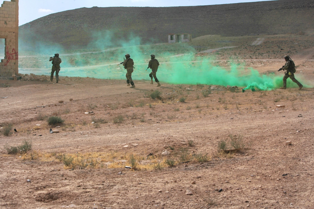 U.S. and Jordanian special operations forces move toward their next objective under the cover of smoke during a simulated raid, as part of exercise Eager Lion 2016 in Al Zarqa, Jordan, May 23, 2016. Army photo by Sgt. 1st Class Sean Foley