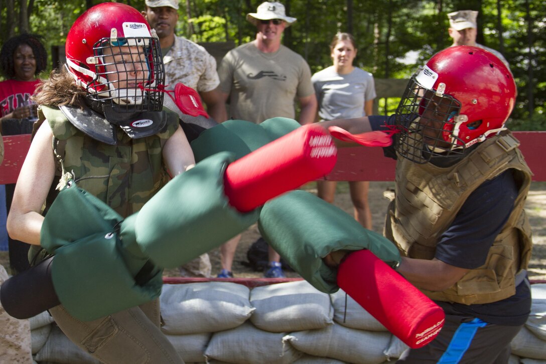 Stephanie Waite, left, and Whitney Edwards execute a pugil stick bout during the martial arts portion of the 2016 Key Leaders and Educators Workshop aboard Marine Corps Base Quantico, Va., June 7.  The week-long workshop demonstrates the rigors of becoming a Marine officer and the benefits of serving in the Corps. The workshop enables educators to provide guidance to America's future leaders based on firsthand experience. Waite is the Senior Associate Director of Career Strategy at Yale University in New Haven, Connecticut. Edwards is a women's basketball assistant coach for the University of New Hampshire in Durham, New Hampshire.