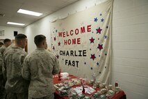 Marines with 5th platoon, Charlie Company, Fleet Anti-Terrorism Team, Marine Corps Security Force Regiment, read their homecoming banner made for them by friends and family after returning to Camp Allen, Norfolk from a seven-month deployment to Bahrain, June 6, 2016. During their deployment, the Marines conducted security operations in the United States Fifth Fleet area of operations, while training alongside other forces in Bahrain, Kuwait, Qatar and Jordan. Along with providing support for their mission, the Marines engaged in training evolutions such as fire team competitions, professional military education and weapon system ranges. (Official Marine Corps photo by Cpl. Calvin Shamoon/ Released)