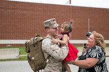 Corporal Jesse Mineer, with 5th platoon, Charlie Company, Fleet Anti-Terrorism Team, Marine Corps Security Force Regiment, hugs his daughter after returning to Camp Allen, Norfolk from a seven-month deployment to Bahrain, June 6, 2016. During their deployment, the Marines conducted security operations in the United States Fifth Fleet area of operations, while training alongside other forces in Bahrain, Kuwait, Qatar and Jordan. Along with providing support for their mission, the Marines engaged in training evolutions such as fire team competitions, professional military education and weapon system ranges. (Official Marine Corps photo by Cpl. Calvin Shamoon/ Released)
