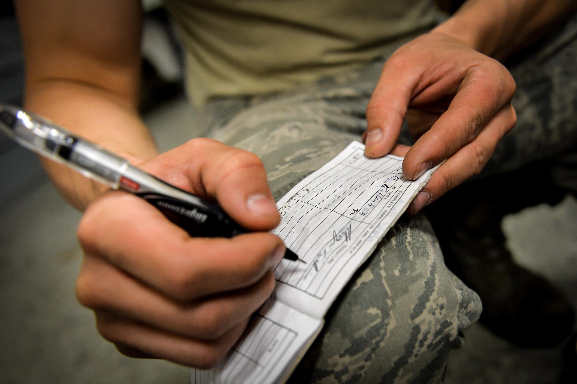 Senior Airman Scott Plummer, 2nd Operations Support Squadron aircrew flight equipment journeyman, updates a drag chute maintenance log at Barksdale Air Force Base, La., June 7, 2016. Plummer updated the log to reflect the correct number of canopy deployments for each chute. The data is used to troubleshoot any issues with the canopy and track usage. (U.S. Air Force photo/Senior Airman Mozer O. Da Cunha)