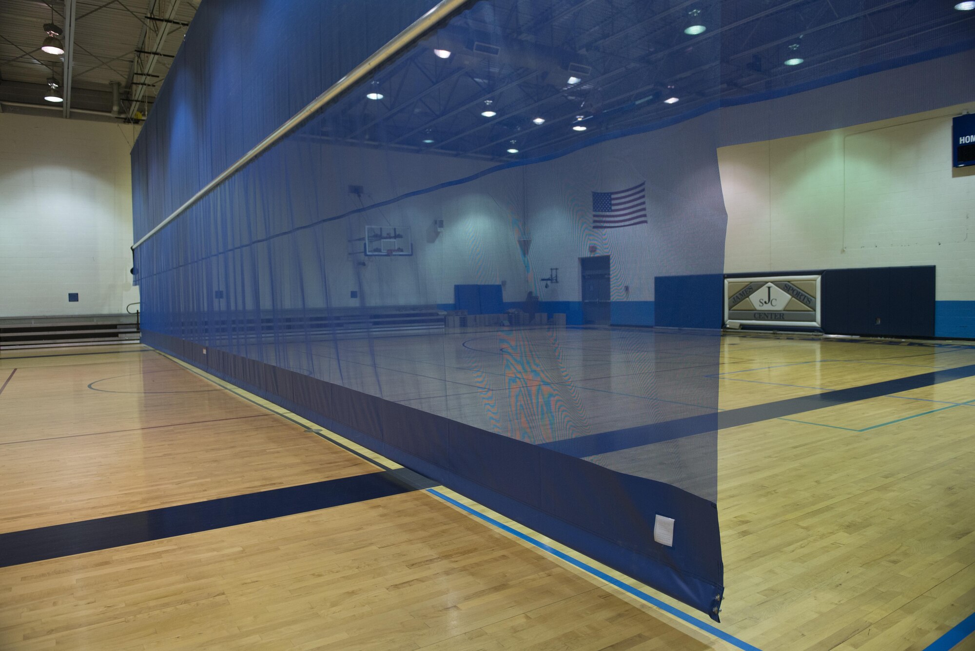 James Sports Center recently acquired a gym divider to host more activities at once for frequent customers. Along with the James Sports Center, the Fitness Center is undergoing renovations including upgrades to plumbing, flooring, and the HVAC system. Renovations are projected to be completed by this fall. (U.S. Air Force photo/ Senior Airman Kiana Brothers)