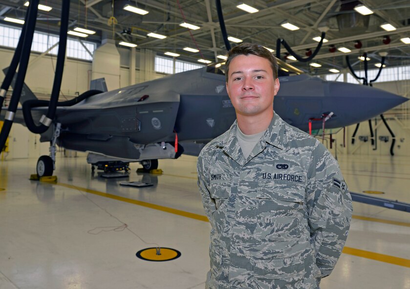 Airman 1st Class Griffin Smith, 33rd Maintenance Squadron aircraft fuels system repairman apprentice, stands with an F-35A Lightning II at Eglin Air Force Base, Fla., June 1, 2016. Smith will soon shed his enlisted chevrons for officer bars after his acceptance into the U.S. Air Force Academy through the Leaders Encouraging Airman Development program. The LEAD program has 170 appointments open to unit commander recommendations for active duty and reserve Airmen to commission as officers. (U.S. Air Force photo/Senior Airman Andrea Posey)