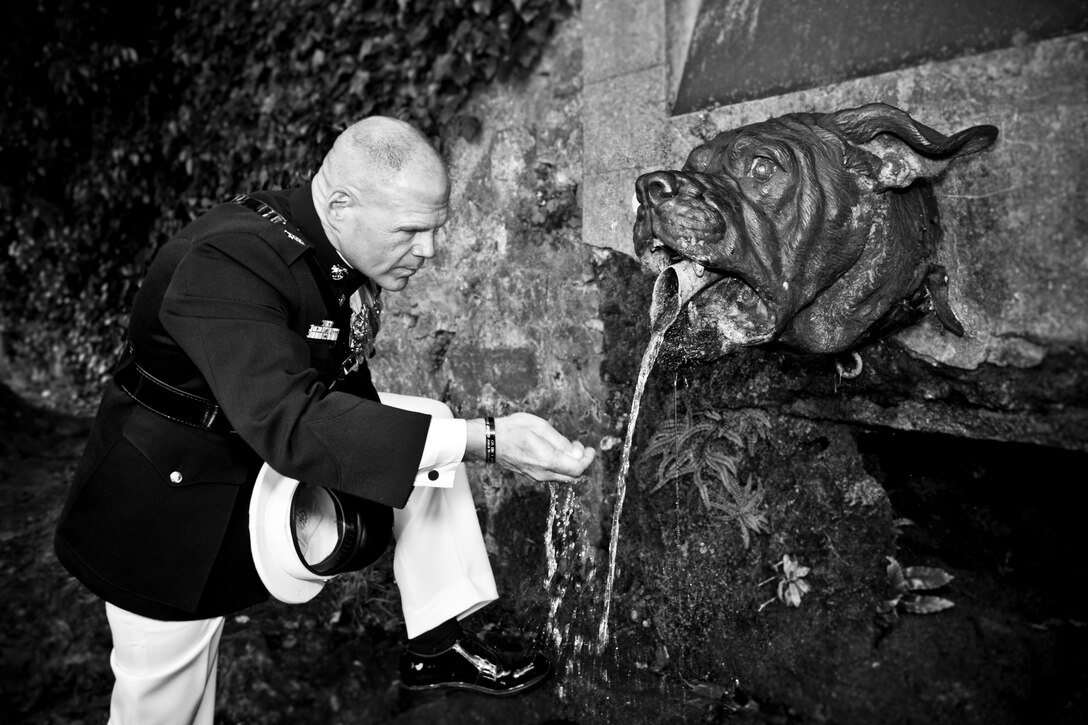 Commandant of the Marine Corps, Gen. Robert B. Neller, gets water from the Devil Dog fountain after the American Memorial Day ceremony at the Aisne-Marne American Memorial Cemetery, Belleau, France, May 29, 2016. Each Memorial Day weekend, U.S. Marines, French service members, family members and locals gather to honor the memory of the Marines killed during the battle of Belleau Wood. 