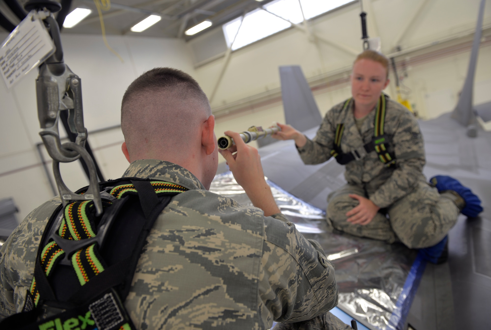 Airman 1st Class William Manion, 33rd Maintenance Squadron fuel systems apprentice, and Senior Airman Samantha Schmedeke, 33rd MXS fuel systems journeyman, ensure a fuel probe is clear of debris  before use at Eglin Air Force Base, Fla., May 16, 2016. This tool is used to check the fuel level of an F-35A Lightning II after flight. (U.S. Air Force photo/Senior Airman Andrea Posey)