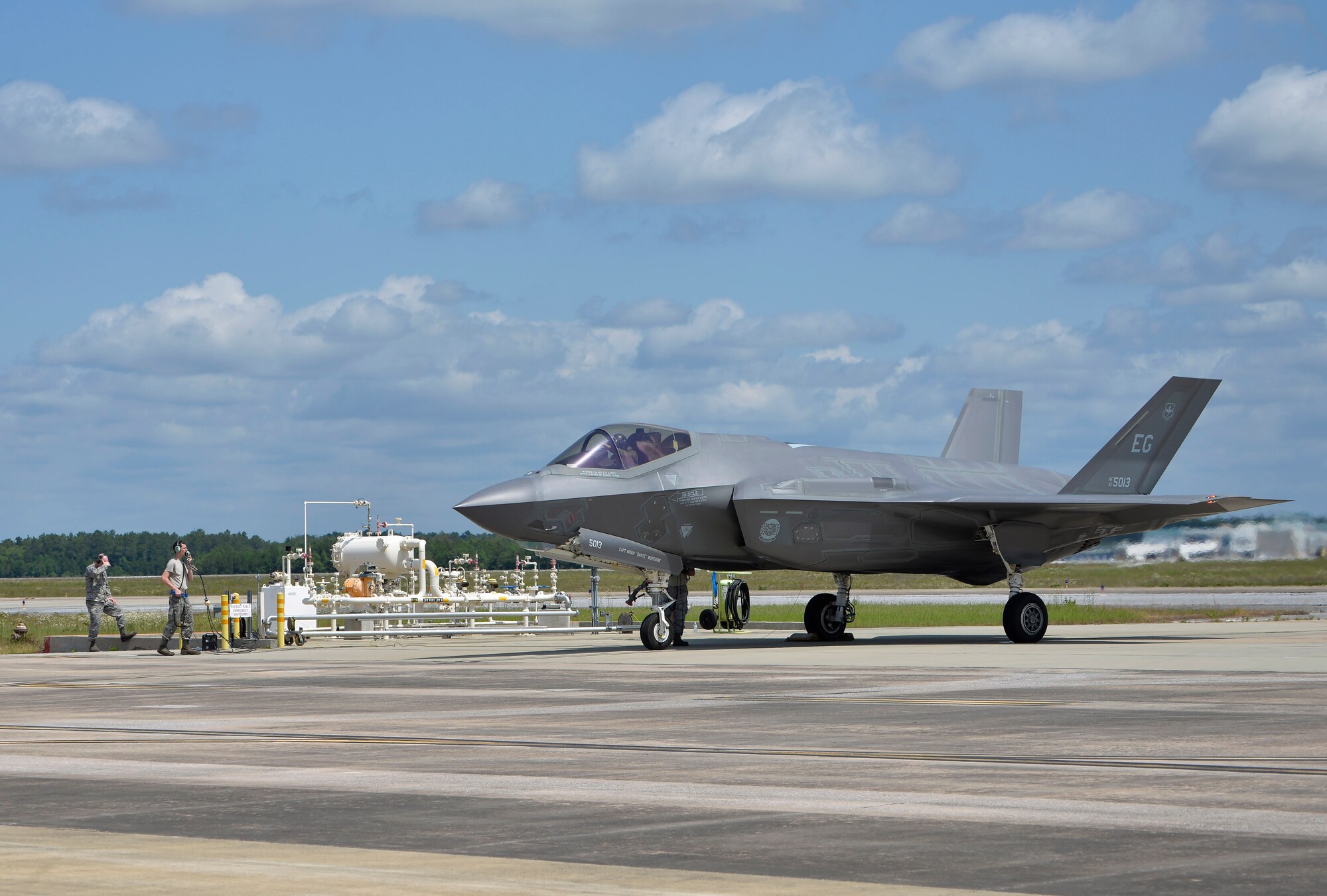 An F-35A Lightning II taxis up to a fuel tank for hot pit refueling at Eglin Air Force Base, Fla., May 13, 2016. This type of aircraft refueling is done while the engine is running to get jets back in the air more quickly and is a common practice during wartime. The alternative is to taxi the aircraft back to the sunshade, shut down, refuel, and re-start the aircraft. Hot pit refueling allows the 58th Fighter Squadron to maximize time flying the fifth-generation jet. (U.S. Air Force photo/Senior Airman Andrea Posey)