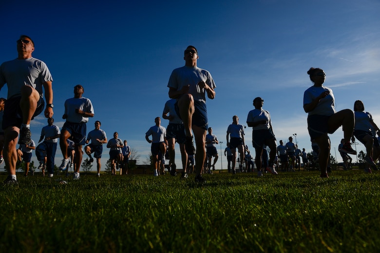Airmen from the 50th Space Wing warm up before the Warfit Run at Schriever Air Force Base, Colorado, Wednesday, June 8, 2016. The monthly run is open to military, civilians and dependents. (U.S. Air Force photo/Christopher DeWitt)