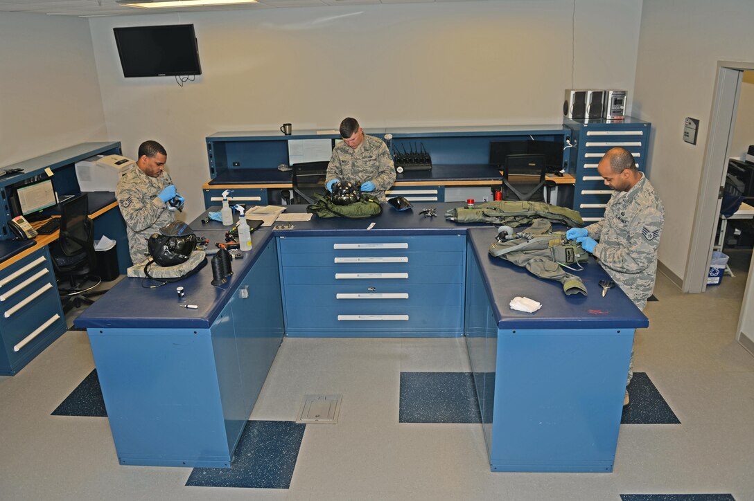 Aircrew flight equipment Airmen conduct a preflight inspection on F-35A Lightning II flight gear at Eglin Air Force Base, Fla., Feb. 29, 2016. The AFE team's mission is to support flight operations by ensuring pilots have reliable equipment in the event of an egress situation. (U.S. Air Force photo/Senior Airman Andrea Posey)