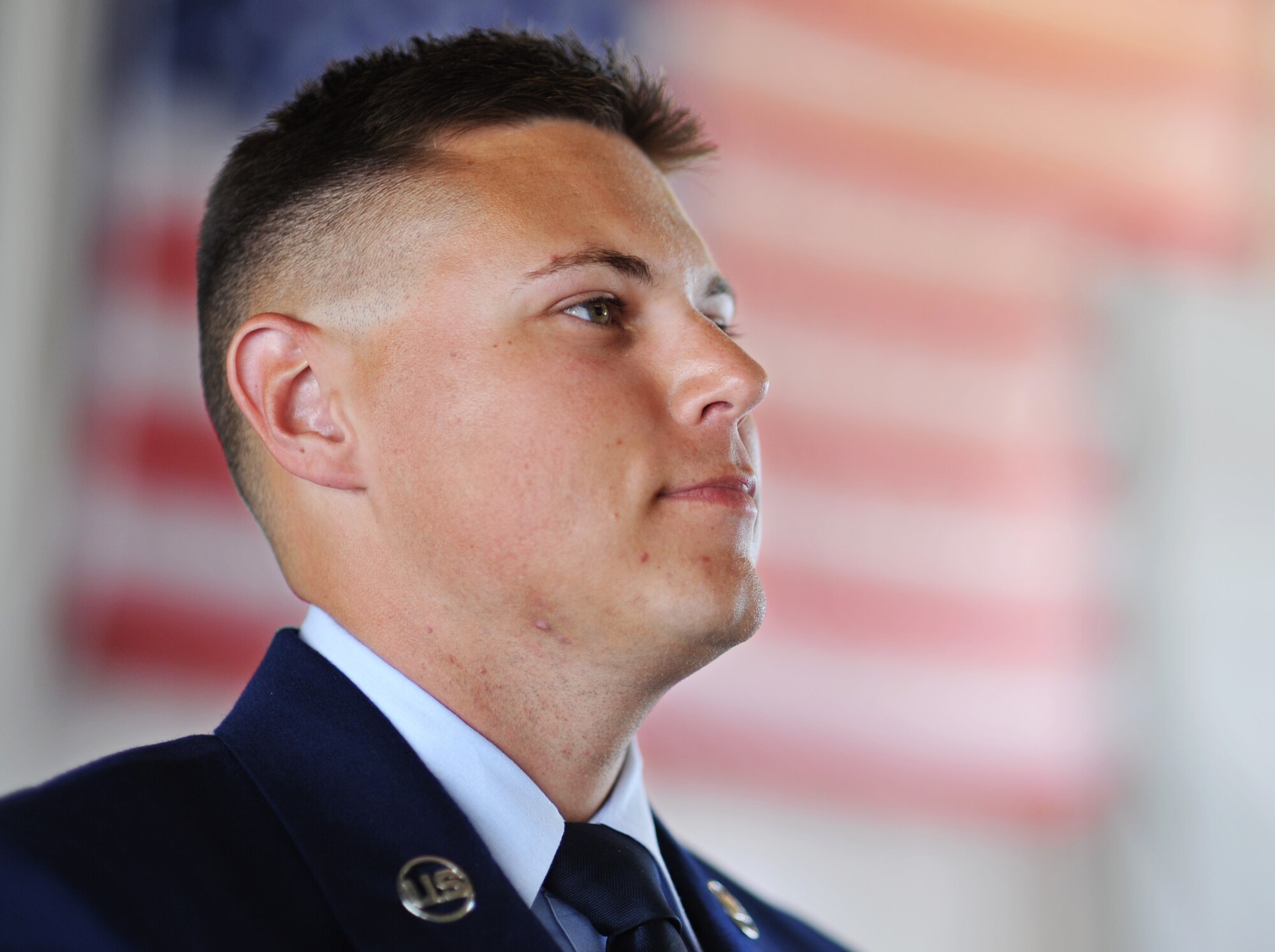 Airman 1st Class Ian Tracy stands at attention during a change of command ceremony June 2. Tracy is the Unsung Hero for the 2nd Fighter Training Squadron. Tracy credits his success in life to his parents, and is motivated by his love of his son. (U.S. Air Force photo by Senior Airman Dustin Mullen/Released) 