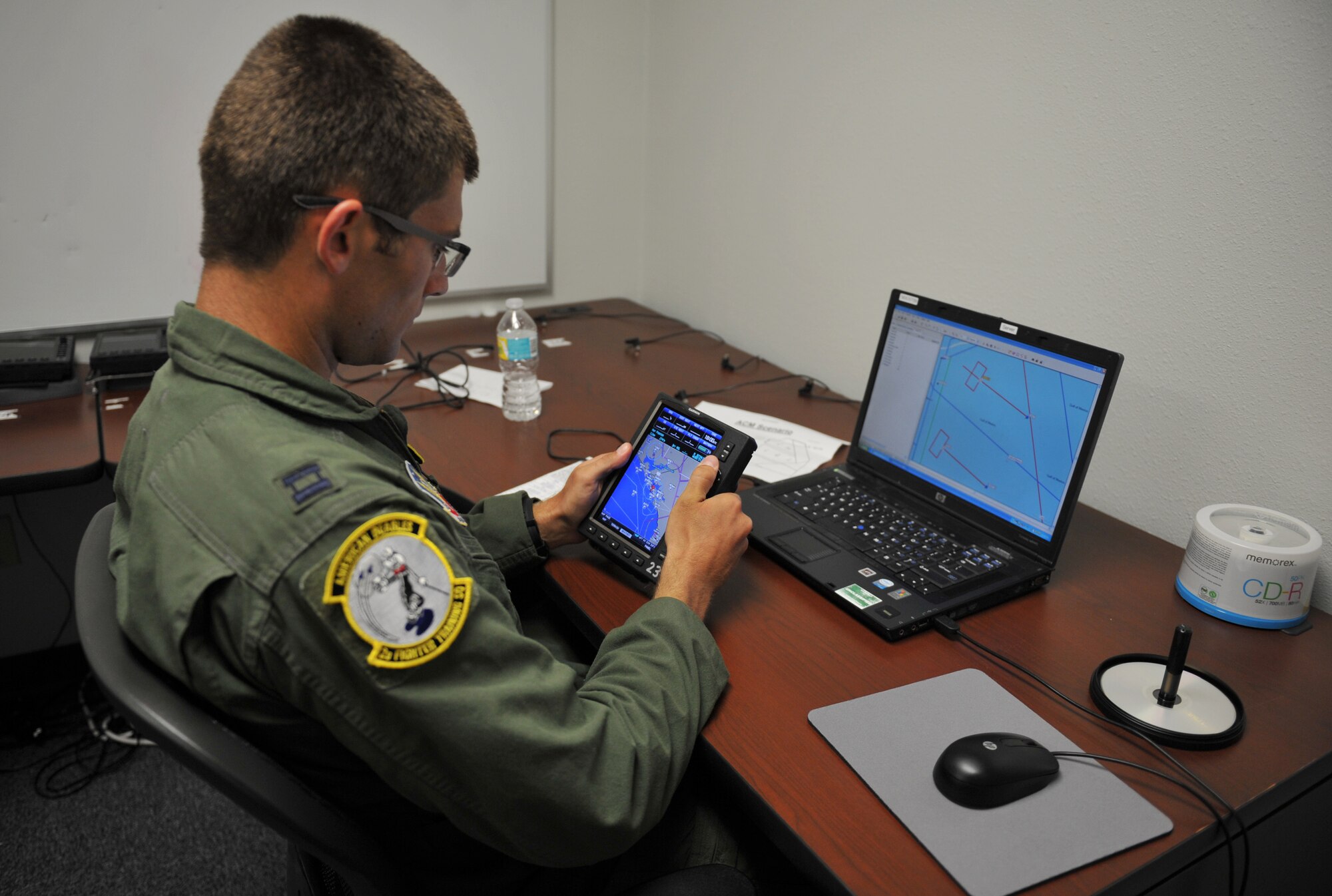 Capt. Caleb Whitlock, 2nd Fighter Training Squadron pilot, programs a GPS system June 1, 2016, at the 2nd FTS building. Because the T-38 Talon has no moving map displays, the GPS system provides increased situational awareness while flying. (U.S. Air Force photo by Senior Airman Dustin Mullen/Released)