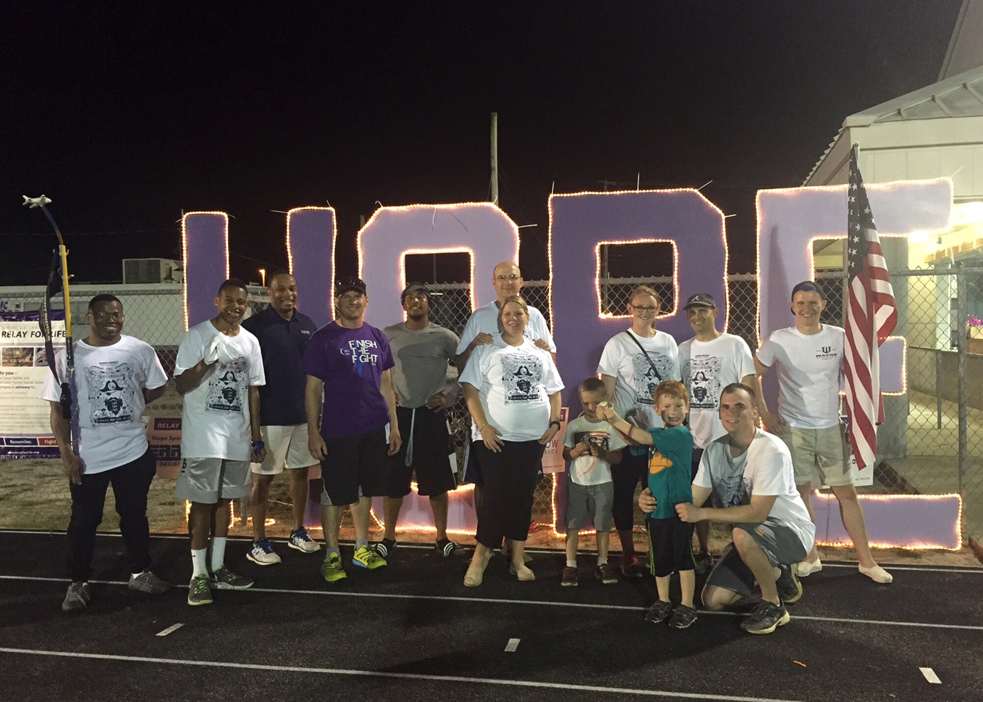 The Embry-Riddle Flying Buccaneers relay team poses for a photo after completing the Relay For Life of Greater Panama City, April 30 at Tommy Oliver Stadium, Panama City, Fla. The team was the combined efforts of Embry-Riddle Aeronautical University Tyndall campus and the base’s Airman Leadership School. Together, more than 50 people walked over 260 miles and raised over $1,400 for cancer research. (Courtesy Photo)