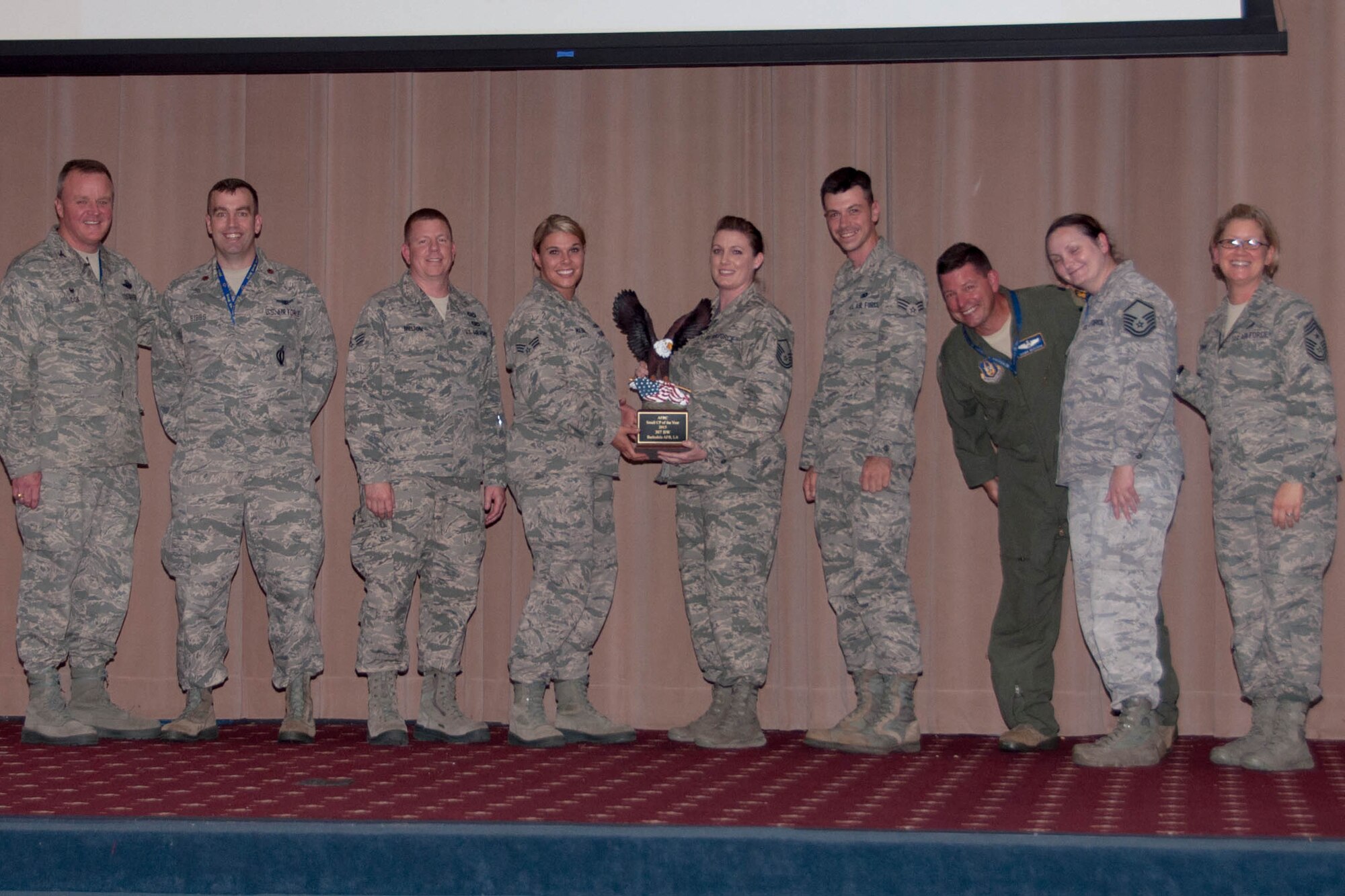 The 307th Bomb Wing Command Post earned the title of 2015 AFRC Small Command Post of the Year. The 307th Bomb Wing Commander, Col. Bruce Cox, and for the 307th Bomb Wing Command Chief, Chief Master Sgt. Shelley Cohen, presented the group with a trophy during Commander’s Call on Barksdale Air Force Base, La., June 5, 2016. (U.S. Air Force photo by Master Sgt. Laura Siebert/Released)