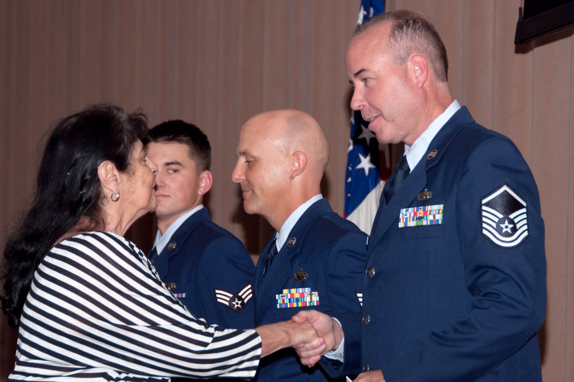 U.S. Air Force Master Sgt. Stephen Sorge is congratulated for winning the 307th Bomb Wing Senior Noncommissioned Officer of the first quarter by Catherine Vanderberry of the Bossier Council on Aging on Barksdale Air Force Base, La., June 5, 2016. Sorge is assigned to the 307th Maintenance Squadron. (U.S. Air Force photo by Master Sgt. Laura Siebert/Released)