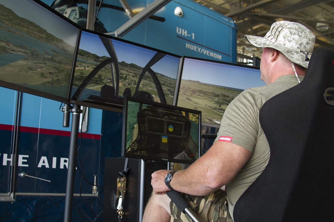 Jason Little operates a flight simulator during the 2016 Key Leaders and Educators Workshop at Marine Helicopter Squadron One aboard Marine Corps Base Quantico, Va., June 8. Educators from states east of the Mississippi River were briefed on flight operations, flew in a MV-22 Osprey and toured the squadron’s hangar during the aviation portion of their visit. The workshop creates a mutually beneficial and meaningful relationship between educators and the Corps where educators can better guide college students who are interested in becoming Marine officers. Little is an educator from McNeese State University, Lake Charles, La.