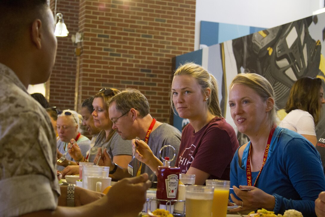 Margaret Anderson, left, and Jamie Chilton, Ph. D., dine with and speak to a Marine during lunch at the Bruce Hall dining facility aboard Marine Corps Base Quantico, Va., June 8. The 39 educators from states east of the Mississippi River are participating in different activities such as patrolling, flight simulations and many others during the week-long 2016 Key Leaders and Educators Workshop. The workshop creates a mutually beneficial and meaningful relationship between educators and the Marine Corps where key leaders and educators can share knowledge about the Corps to students based on firsthand experience. Anderson is an admissions counselor for Bob Jones University, Greenville S.C. Chilton is an adjunct instructor and career consultant for the University of South Florida, Tampa, Fl.